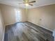 Bedroom with gray vinyl flooring and sliding glass door at 501 Country Park Se Dr, Smyrna, GA 30080
