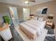 Virtually staged bedroom with wood floors and ceiling fan at 501 Country Park Se Dr, Smyrna, GA 30080