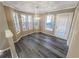 Sunlit dining area with bay windows and modern chandelier at 501 Country Park Se Dr, Smyrna, GA 30080