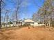 House exterior showcasing a tranquil setting nestled among trees at 501 Country Park Se Dr, Smyrna, GA 30080
