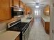 Kitchen features wood cabinets, stainless steel appliances and tile floors at 501 Country Park Se Dr, Smyrna, GA 30080