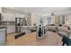 Modern kitchen with white cabinets, island and stainless steel appliances at 10 Camellia Dr, Fairburn, GA 30213