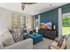 Cozy living room with a teal accent wall and ample natural light at 10 Camellia Dr, Fairburn, GA 30213