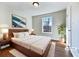 Bright bedroom with wood floors and large window at 114 Blake Cv, Douglasville, GA 30134