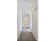 Long hallway with carpeted floors and access to bedrooms at 114 Blake Cv, Douglasville, GA 30134