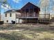 House back view showing a large deck and screened porch at 114 Blake Cv, Douglasville, GA 30134