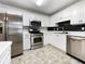 Modern kitchen with stainless steel appliances and white cabinets at 114 Blake Cv, Douglasville, GA 30134