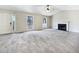 Spacious living room featuring a fireplace and large windows at 114 Blake Cv, Douglasville, GA 30134