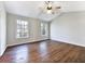 Large main bedroom with wood flooring and ceiling fan at 114 Blake Cv, Douglasville, GA 30134