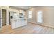 Kitchen with white cabinets, island, and stainless steel appliances at 17 Camellia Dr, Fairburn, GA 30213