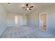 Large main bedroom with carpet and multiple windows at 17 Camellia Dr, Fairburn, GA 30213