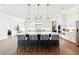 Modern kitchen with white cabinets, a large island, and black barstools at 2937 Dansby Run, Acworth, GA 30101