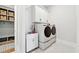 Laundry room with washer, dryer, and utility sink at 2937 Dansby Run, Acworth, GA 30101