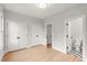 Bedroom with hardwood floors, closets, and en-suite bathroom at 1697 Thomas St, Decatur, GA 30032