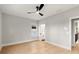 Bright bedroom featuring wood floors, ceiling fan and en-suite bathroom at 1697 Thomas St, Decatur, GA 30032