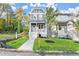 Two-story craftsman home with gray siding, white trim, and a landscaped front yard at 1697 Thomas St, Decatur, GA 30032