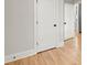 Hardwood floor hallway with white doors and baseboards at 1697 Thomas St, Decatur, GA 30032