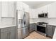 Modern kitchen with stainless steel appliances and white and gray cabinetry at 1697 Thomas St, Decatur, GA 30032
