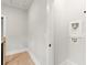 Upstairs laundry closet with light gray walls and wood flooring at 1697 Thomas St, Decatur, GA 30032