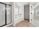 Main bathroom with soaking tub, walk-in shower, and tile flooring at 1736 Dylan Pl, Lawrenceville, GA 30043