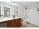 Bathroom features wood vanity, large mirror, and shower/tub combo at 1736 Dylan Pl, Lawrenceville, GA 30043