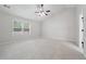 Large bedroom featuring neutral walls and ceiling fan at 1736 Dylan Pl, Lawrenceville, GA 30043