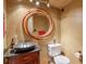 Stylish bathroom with a large circular mirror and vessel sink at 1845 Annwicks Dr, Marietta, GA 30062