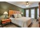 Large bedroom with a wooden headboard and ceiling fan at 1845 Annwicks Dr, Marietta, GA 30062