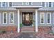 Elegant front door with a glass insert and brick steps at 1845 Annwicks Dr, Marietta, GA 30062