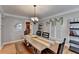 Elegant dining room featuring a rustic table and hardwood floors at 3255 Embry Hills Dr, Atlanta, GA 30341