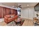 Bright living room features hardwood floors, a comfy couch, and built-in shelving at 3255 Embry Hills Dr, Atlanta, GA 30341