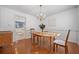 Formal dining room with hardwood floors, chandelier, and built-in cabinetry at 585 Tyson Knls, Roswell, GA 30076