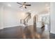 Open living area with dark hardwood floors and modern staircase at 64 Rogers Ne St, Atlanta, GA 30317