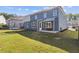 Large backyard with patio, trampoline, and grass at 711 Bridgeview Dr, Holly Springs, GA 30115