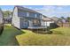 Spacious backyard with trampoline and grass at 711 Bridgeview Dr, Holly Springs, GA 30115