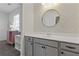 Bathroom with gray vanity and gold speckled wallpaper at 711 Bridgeview Dr, Holly Springs, GA 30115