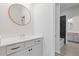 Bathroom with gray vanity and a view of a bathtub at 711 Bridgeview Dr, Holly Springs, GA 30115