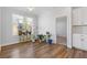Bright breakfast room features wood floors and access to backyard at 711 Bridgeview Dr, Holly Springs, GA 30115