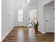 Bright and spacious entryway with hardwood floors and access to other rooms at 711 Bridgeview Dr, Holly Springs, GA 30115