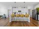 Modern kitchen with white cabinets, quartz countertops, and stainless steel appliances at 711 Bridgeview Dr, Holly Springs, GA 30115
