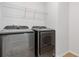 Laundry room with side-by-side washer and dryer at 711 Bridgeview Dr, Holly Springs, GA 30115