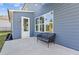 Private patio with a gray couch and backyard access at 711 Bridgeview Dr, Holly Springs, GA 30115