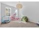 Spacious playroom with toys and a comfy couch at 711 Bridgeview Dr, Holly Springs, GA 30115