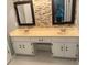 Double vanity bathroom with stone tile accents at 8374 Carlton Rd, Riverdale, GA 30296
