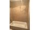 Clean bathroom with shower and tile surround at 8374 Carlton Rd, Riverdale, GA 30296