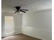 Bright bedroom with ceiling fan and neutral walls at 8374 Carlton Rd, Riverdale, GA 30296