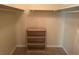 Walk-in closet with shelving and hanging rods at 8374 Carlton Rd, Riverdale, GA 30296