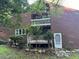 Brown wood siding condo with deck and balcony at 8374 Carlton Rd, Riverdale, GA 30296