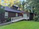 Back of house with ramp access and large yard at 8374 Carlton Rd, Riverdale, GA 30296