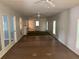 Large living room with tile floors and ceiling fans at 8374 Carlton Rd, Riverdale, GA 30296